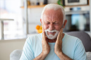 Man experiencing dental emergency