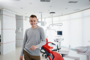 young man comfortable at the dentist's office sedation dentistry concept