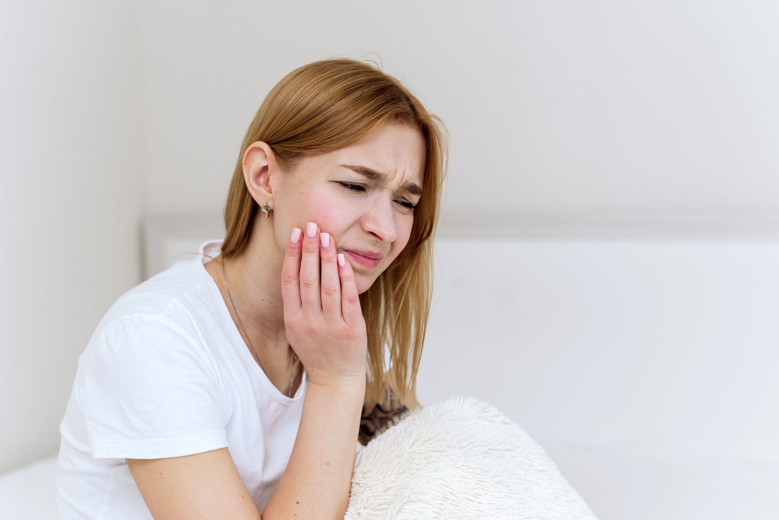 woman with morning jaw pain bruxism concept