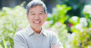 Man smiling standing in nature