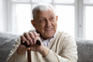 Head shot smiling old disabled man 