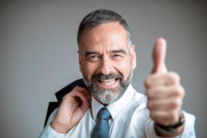 Senior business man approving, giving a thumb up, giving you full support